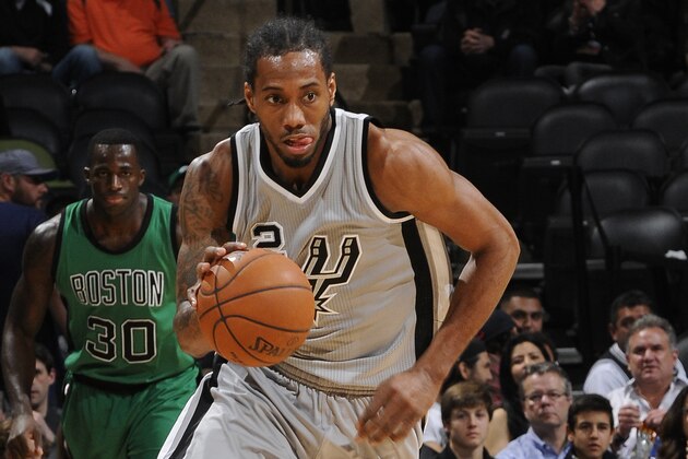 SAN ANTONIO, TX - MARCH 20:  Kawhi Leonard #2 of the San Antonio Spurs brings the ball up court against the Boston Celtics on March 20, 2015 at the AT&T Center in San Antonio, Texas. NOTE TO USER: User expressly acknowledges and agrees that, by downloading and or using this Photograph, user is consenting to the terms and conditions of the Getty Images License Agreement. Mandatory Copyright Notice: Copyright 2015 NBAE (Photo by D. Clarke Evans/NBAE via Getty Images)