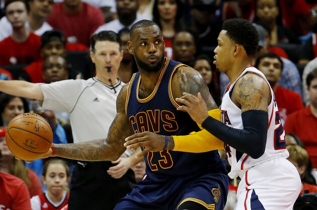 ATLANTA, GA - MAY 20:  LeBron James #23 of the Cleveland Cavaliers drives against Kent Bazemore #24 of the Atlanta Hawks in the second half during Game One of the Eastern Conference Finals of the 2015 NBA Playoffs at Philips Arena on May 20, 2015 in Atlanta, Georgia. NOTE TO USER: User expressly acknowledges and agrees that, by downloading and or using this Photograph, user is consenting to the terms and conditions of the Getty Images License Agreement.  (Photo by Kevin C. Cox/Getty Images)