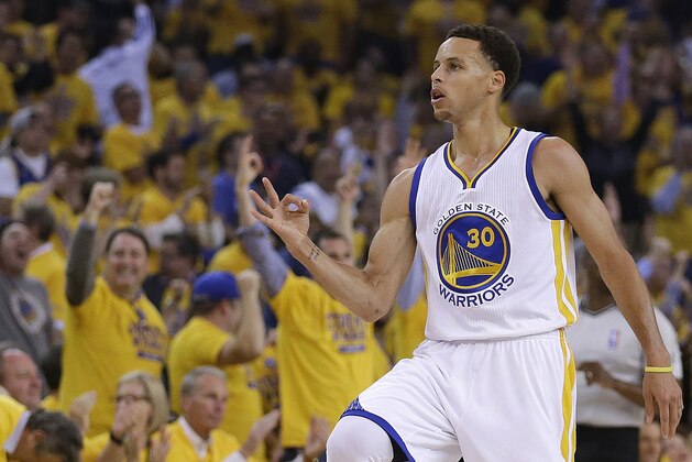 Golden State Warriors' Stephen Curry celebrates after a score during the first quarter of Game 1 of the NBA basketball Western Conference finals against the Houston Rockets Tuesday, May 19, 2015, in Oakland, Calif. (AP Photo/Ben Margot)