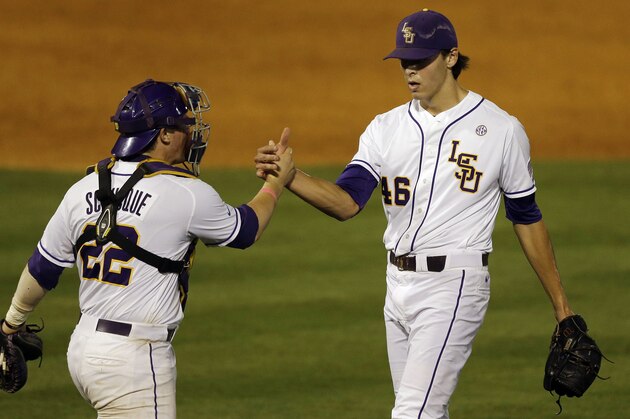 LSU’s Kade Scivicque celebrates with Parker Bugg (46) after they defeated Auburn 9-8 in a game at the Southeastern Conference college baseball tournament at the Hoover Met, Wednesday, May 20, 2015, in Hoover, Ala. (AP Photo/Butch Dill)