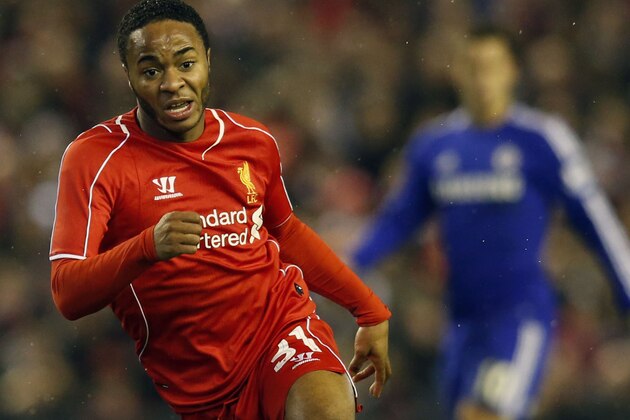 Liverpool's Raheem Sterling runs with the ball during the English League Cup semi-final first leg soccer match between Liverpool and Chelsea at Anfield Stadium, Liverpool, England, Tuesday Jan. 20, 2015. (AP Photo/Jon Super)