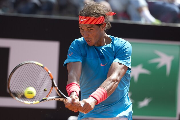 Rafael Nadal, of Spain, returns the ball to Marsel Ilhan of Turkey during their match at the Italian Open tennis tournament, in Rome, Wednesday, May 13, 2015. (AP Photo/Andrew Medichini)