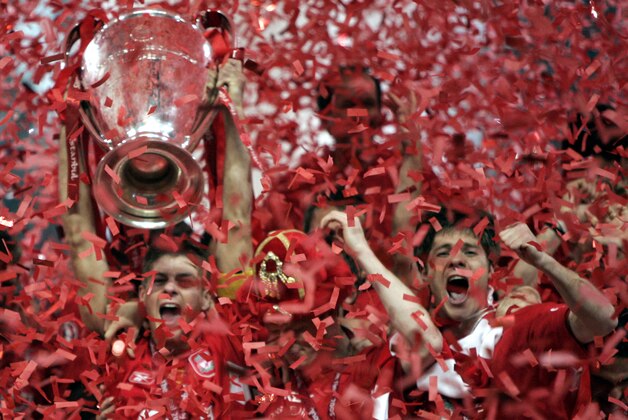 Liverpool's captain Steven Gerrard, left, holds the trophy after Liverpool's victory in the the UEFA Champions League Final between AC Milan and Liverpool at the Ataturk Olympic Stadium in  Istanbul, Turkey,Wednesday May 25, 2005. Liverpool won the match 3-2 on penalties.(AP Photo/Dusan Vranic)