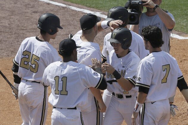 Vanderbilt’s Jeren Kendall (3) celebrates with teammates after he hit a home run during the seventh inning of a game against Missouri at the Southeastern Conference college baseball tournament at the Hoover Met, Wednesday, May 20, 2015, in Hoover, Ala. (AP Photo/Butch Dill)