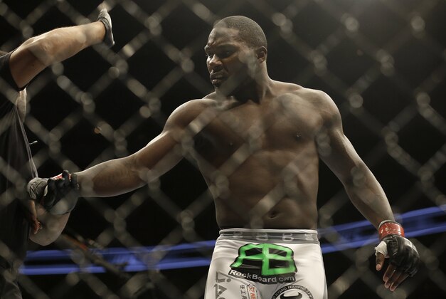 Anthony Johnson is pushed away by referee Herb Dean after beating Antonio Rogerio Nogueira by technical knockout during a light heavyweight mixed martial arts bout at a UFC on Fox event in San Jose, Calif., Saturday, July 26, 2014. Johnson won by technical knockout. (AP Photo/Jeff Chiu)