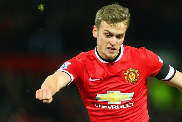 MANCHESTER, ENGLAND - FEBRUARY 03: James Wilson of Manchester United scores the third goal during the FA Cup Fourth round replay match between Manchester United and Cambridge United at Old Trafford on February 3, 2015 in Manchester, England.  (Photo by Clive Mason/Getty Images)