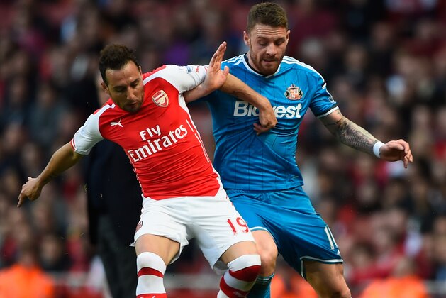 LONDON, ENGLAND - MAY 20: Santi Cazorla of Arsenal and Connor Wickham of Sunderland battle for the ball during the Barclays Premier League match between Arsenal and Sunderland at Emirates Stadium on May 20, 2015 in London, England. (Photo by Mike Hewitt/Getty Images) LONDON, ENGLAND - MAY 20: Santi Cazorla of Arsenal and Connor Wickham of Sunderland battle for the ball during the Barclays Premier League match between Arsenal and Sunderland at Emirates Stadium on May 20, 2015 in London, England. (Photo by Mike Hewitt/Getty Images)