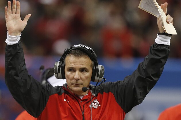 Ohio State head coach Urban Meyer indicates a Ohio State touchdown by wide receiver Michael Thomas in the first half of the Sugar Bowl NCAA college football playoff semifinal game against Alabama, Thursday, Jan. 1, 2015, in New Orleans. (AP Photo/Bill Haber)