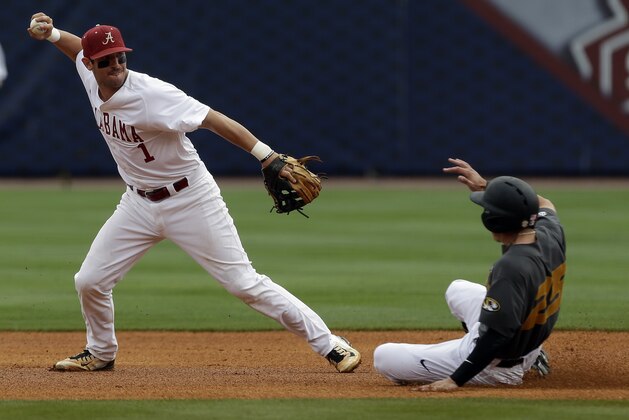 Alabama’s Mikey White (1) throws to first base after getting the force out on Missouri’s Jake Ring (25) as he slides into second base during the first inning of a game against Missouri at the Southeastern Conference college baseball tournament at the Hoover Met, Thursday, May 21, 2015, in Hoover, Ala. (AP Photo/Butch Dill)