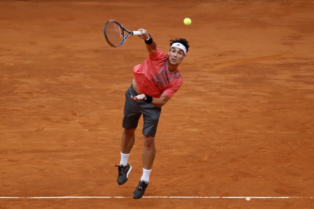Fabio Fognini from Italy serves the ball during the Madrid Open tennis tournament match against Santiago Giraldo from Colombia in Madrid, Spain, Monday, May 4, 2015. (AP Photo/Daniel Ochoa de Olza)