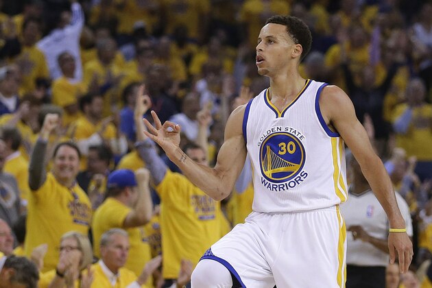 Golden State Warriors' Stephen Curry celebrates after a score during the first quarter of Game 1 of the NBA basketball Western Conference finals against the Houston Rockets Tuesday, May 19, 2015, in Oakland, Calif. (AP Photo/Ben Margot)