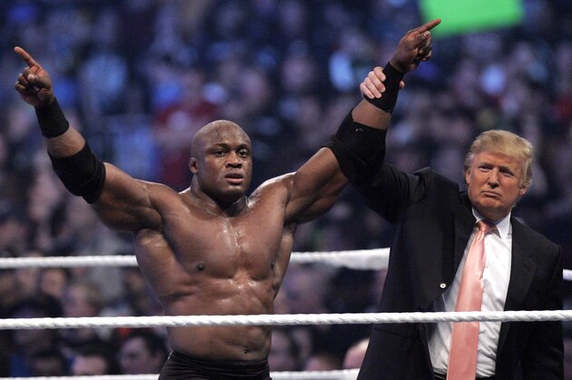 Donald Trump raises the arm of wrestler Bobby Lashley after he defeated Umaga at Wrestlemania 23 at Ford Field in Detroit, Sunday, April 1, 2007. (AP Photo/Carlos Osorio)