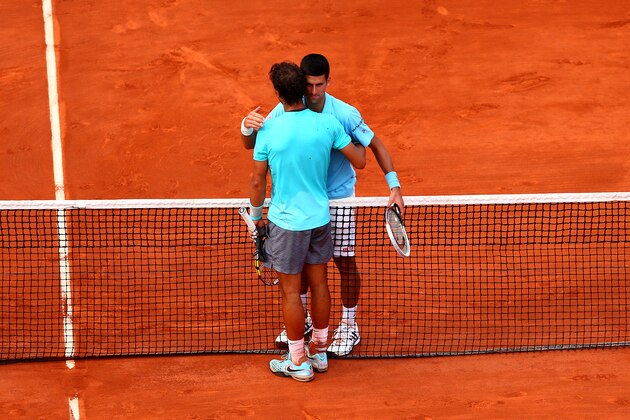 PARIS, FRANCE - JUNE 08:  Rafael Nadal of Spain shakes hands with Novak Djokovic of Serbia after their men's singles final match on day fifteen of the French Open at Roland Garros on June 8, 2014 in Paris, France.  (Photo by Dan Istitene/Getty Images)