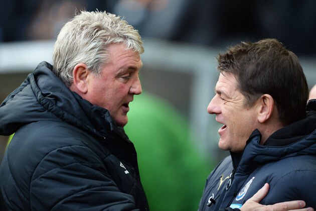 HULL, ENGLAND - JANUARY 31: Steve Bruce, manager of Hull City greets John Carver, manager of Newcastle United during the Barclays Premier League match between Hull City and Newcastle United at KC Stadium on January 31, 2015 in Hull, England.  (Photo by Nigel Roddis/Getty Images)