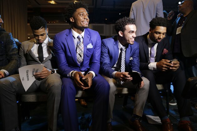 NBA basketball draft prospects, from left, D'Angelo Russell, Justice Winslow, Tyus Jones and Jahlil Okafor wait for the start of the draft lottery Tuesday, May 19, 2015, in New York. (AP Photo/Julie Jacobson)
