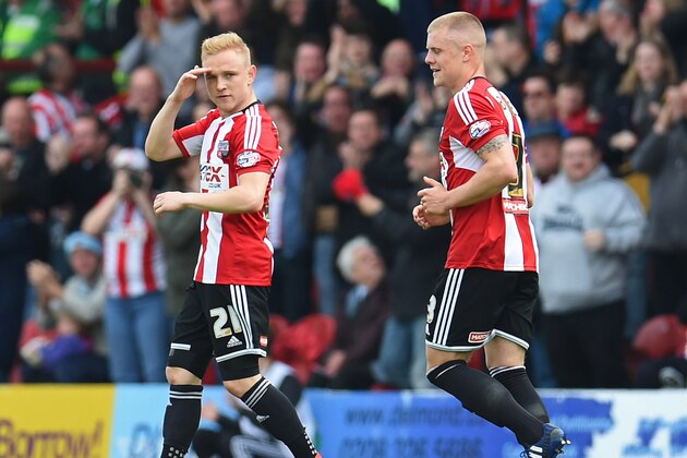 BRENTFORD, ENGLAND - MAY 02: Alex Pritchard of Brentford celebrates scoring the opening goal during the Sky Bet Championship match between Brentford and Wigan Athletic at Griffin Park on May 2, 2015 in Brentford, England.  (Photo by Tom Dulat/Getty Images)