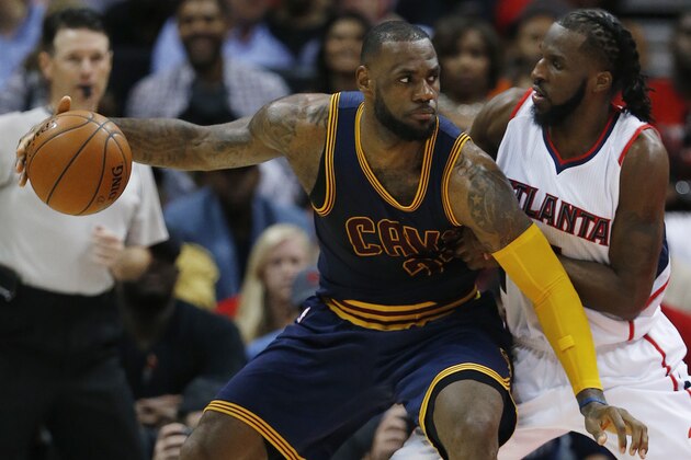 Cleveland Cavaliers forward LeBron James (23) drives against Atlanta Hawks forward DeMarre Carroll (5) during the first half in Game 1 of the Eastern Conference finals of the NBA basketball playoffs, Wednesday, May 20, 2015, in Atlanta. (AP Photo/John Bazemore)