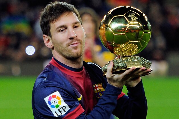BARCELONA, SPAIN - JANUARY 16: Lionel Messi of Barcelona FC offers his 4th ballon d'or to the audience prior to the Copa del Rey Quarter Final match between Barcelona FC and Malaga CF at Camp Nou on January 16, 2013 in Barcelona, Spain.  (Photo by Gonzalo Arroyo Moreno/Getty Images)