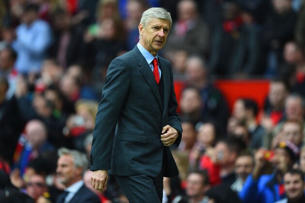 MANCHESTER, ENGLAND - MAY 17:  Arsene Wenger manager of Arsenal looks on at half time during the Barclays Premier League match between Manchester United and Arsenal at Old Trafford on May 17, 2015 in Manchester, England.  (Photo by Shaun Botterill/Getty Images)