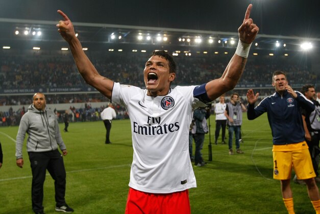 Paris Saint Germain's Brazilian defender Thiago Silva, celebrates with supporters, after defeating Montpellier, and winning  the French League One title, at the end of the League One soccer match between Montpellier and Paris Saint-Germain, at the La Mosson Stadium, in Montpellier, southern France, Saturday, May 16, 2015.  (AP Photo/Claude Paris)