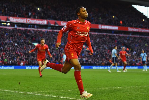 LIVERPOOL, ENGLAND - JANUARY 31: Raheem Sterling of Liverpool celebrates scoring the opening goal during the Barclays Premier League match between Liverpool and West Ham United at Anfield on January 31, 2015 in Liverpool, England.  (Photo by Shaun Botterill/Getty Images)
