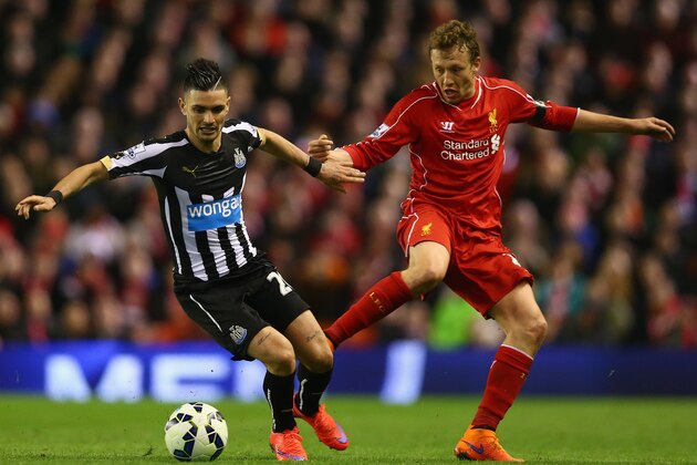 LIVERPOOL, ENGLAND - APRIL 13:  Remy Cabella of Newcastle United in action with Lucas Leiva of Liverpool during the Barclays Premier League match between Liverpool and Newcastle United at Anfield on April 13, 2015 in Liverpool, England.  (Photo by Clive Brunskill/Getty Images)
