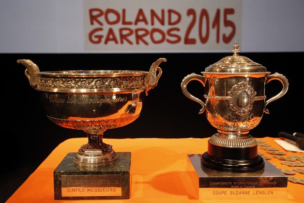 The men singles trophy, left, and the women signes trophy are pictured before  the draw for the French Tennis Open at the Roland Garros stadium, Friday, May 22, 2015 in Paris, France. The French Open starts Sunday. (AP Photo/Francois Mori)