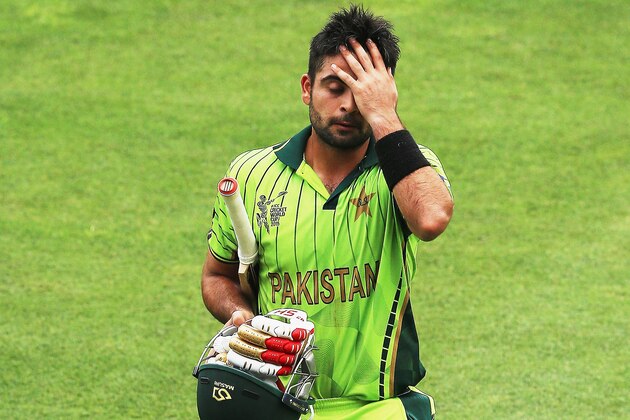 NAPIER, NEW ZEALAND - MARCH 04:  Ahmed Shehzad of Pakistan walks off after being run out during the 2015 ICC Cricket World CUp match between Pakistan and the United Arab Emirates at McLean Park on March 4, 2015 in Napier, New Zealand.  (Photo by Hannah Peters/Getty Images)