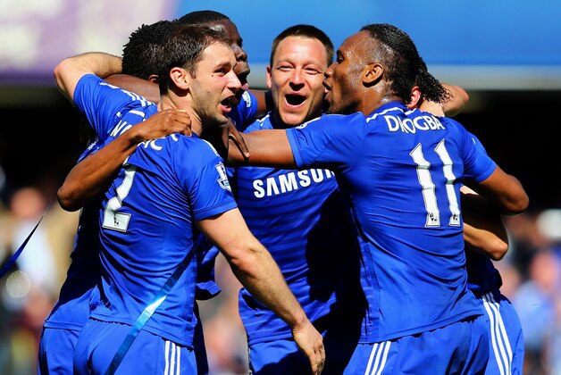 LONDON, ENGLAND - MAY 03:  John Terry (C) and Branislav Ivanovic (L) and Didier Drogba of Chelsea (R) celebrate winning the Premier League title after the Barclays Premier League match between Chelsea and Crystal Palace at Stamford Bridge on May 3, 2015 in London, England. Chelsea became champions with a 1-0 victory.  (Photo by Clive Mason/Getty Images)