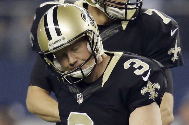 New Orleans Saints kicker Shayne Graham (3) reacts after missing a field goal during the first half of an NFL football game against the Dallas Cowboys, Sunday, Sept. 28, 2014, in Arlington, Texas. Dallas won 38-17. (AP Photo/Tim Sharp)