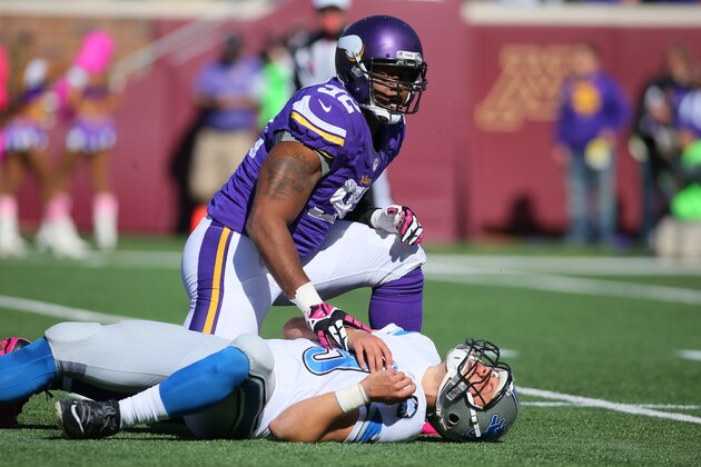 MINNEAPOLIS, MN - OCTOBER 12:  Quarterback Matthew Stafford #9 of the Detroit Lions lays on the ground after being hit by Tom Johnson #92 of the Minnesota Vikings during the first quarter on October 12, 2014 at TCF Bank Stadium in Minneapolis, Minnesota. (Photo by Adam Bettcher/Getty Images)