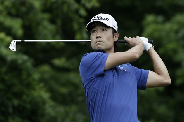 Kevin Na watches his tee shot on the eighth hole during the second round of the Colonial golf tournament, Friday, May 22, 2015, in Fort Worth, Texas. (AP Photo/LM Otero)