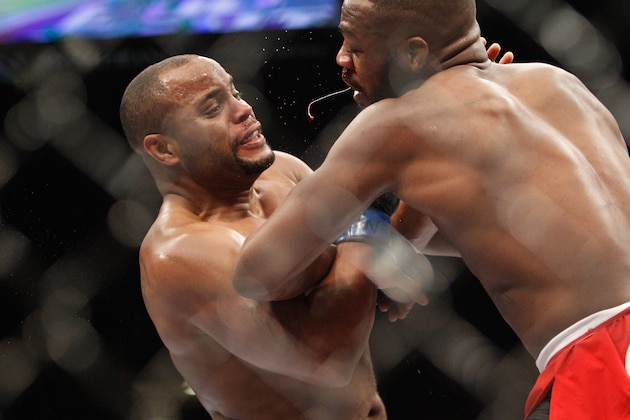LAS VEGAS, NV - JANUARY 03:  Daniel Comier (L) fends off an attack by light heavyweight champion Jon Jones during the UFC 182 event at the MGM Grand Garden Arena on January 3, 2015 in Las Vegas, Nevada. Jones retained his title by unanimous decision.  (Photo by Steve Marcus/Getty Images)