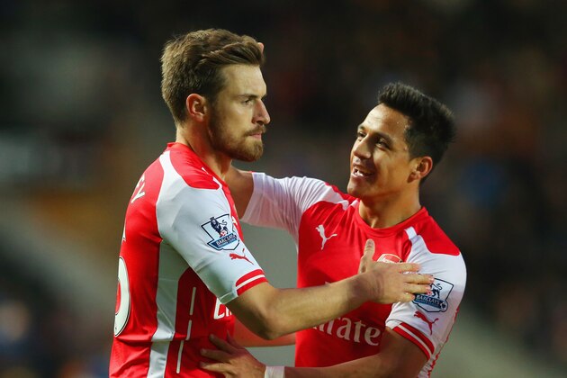 HULL, ENGLAND - MAY 04:  Aaron Ramsey of Arsenal (L) celebrates with Alexis Sanchez (R) as he scores their second goal during the Barclays Premier League match between Hull City and Arsenal at KC Stadium on May 4, 2015 in Hull, England.  (Photo by Alex Livesey/Getty Images)