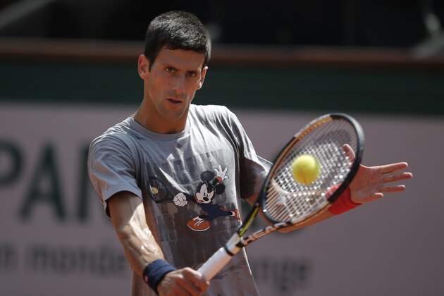 Serbia's Novak Djokovic returns the ball during a training session for the French Tennis Open at the Roland Garros stadium, Friday, May 22, 2015 in Paris. The French Open starts Sunday. (AP Photo/Francois Mori)