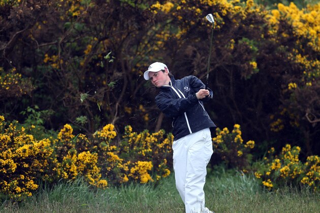 NAIRN, SCOTLAND - JUNE 09:  Leona Maguire of Ireland and the Great Britain and Ireland plays her second shot from deep rough at the 16th hole during the morning foursomes matches in the 37th Curtis Cup Match held at Nairn Golf Club on June 9, 2012  in Nairn, Scotland.  (Photo by David Cannon/Getty Images)