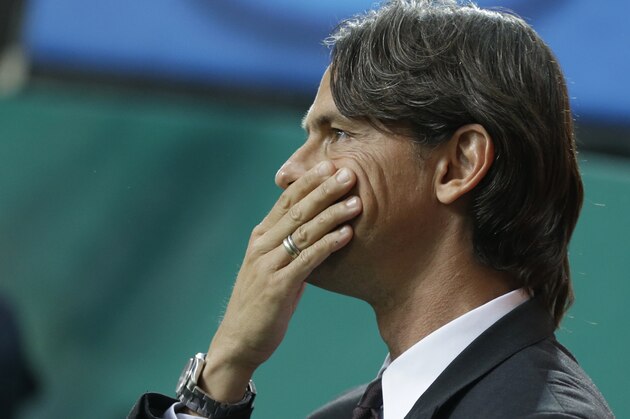 AC Milan coach Filippo Inzaghi touches his face during a Serie A soccer match between AC Milan and Roma, at the San Siro stadium in Milan, Italy, Saturday, May 9, 2015. (AP Photo/Luca Bruno)