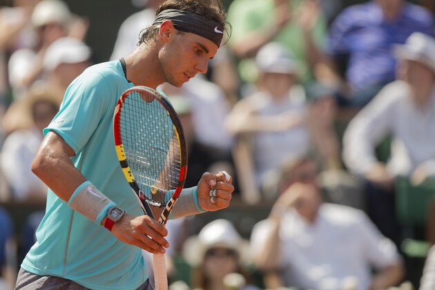 Jun 8, 2014; Paris, France; Rafael Nadal (ESP) reacts during his match against Novak Djokovic (SRB) on day 15 at the 2014 French Open at Roland Garros. Mandatory Credit: Susan Mullane-USA TODAY Sports