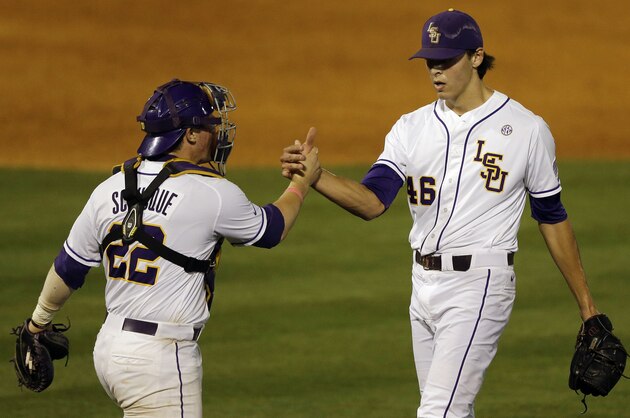 LSU’s Kade Scivicque celebrates with Parker Bugg (46) after they defeated Auburn 9-8 in a game at the Southeastern Conference college baseball tournament at the Hoover Met, Wednesday, May 20, 2015, in Hoover, Ala. (AP Photo/Butch Dill)