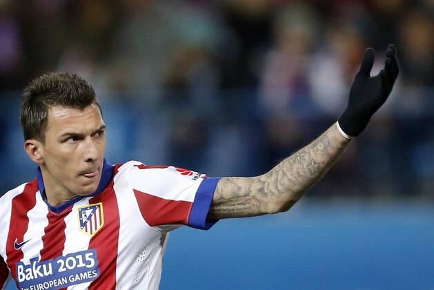 Atletico's Mario Mandzukic from Croatia celebrates after scoring a goal during a Spanish La Liga soccer match between Atletico de Madrid and Almeria at the Vicente Calderon stadium in Madrid, Spain, Saturday, Feb. 21, 2015. (AP Photo/Daniel Ochoa de Olza)