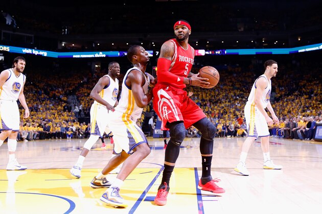 OAKLAND, CA - MAY 21: Josh Smith #5 of the Houston Rockets handles the ball against Harrison Barnes #40 of the Golden State Warriors in the first quarter during game two of the Western Conference Finals of the 2015 NBA PLayoffs at ORACLE Arena on May 21, 2015 in Oakland, California. NOTE TO USER: User expressly acknowledges and agrees that, by downloading and or using this photograph, user is consenting to the terms and conditions of Getty Images License Agreement.  (Photo by Ezra Shaw/Getty Images)