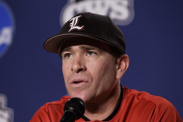 FILE - In this June, 2014, file photo, Louisville baseball coach Dan McDonnell speaks at a news conference ahead of the NCAA baseball College World Series tournament in Omaha, Neb. Louisville hasn’t even been in the Atlantic Coast Conference for a full year. For these Cardinals, that’s still long enough to feel the weight of the league’s pesky national title drought. The ACC’s best chance at its first national championship in 60 years might ride with its newest member. (AP Photo/Nati Harnik, File)