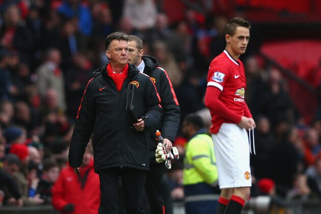 MANCHESTER, ENGLAND - FEBRUARY 28:  Manager Louis van Gaal of Manchester United walks back to the bench after half time as Adnan Januzaj of Manchester United prepares to come on during the Barclays Premier League match between Manchester United and Sunderland at Old Trafford on February 28, 2015 in Manchester, England.  (Photo by Clive Brunskill/Getty Images)