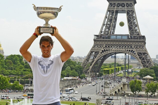 PARIS, FRANCE - JUNE 09: Rafael Nadal of Spain poses with the Coupe des Mousquetaires trophy in front of the Eiffel Tower after his victory against Novak Djokovic of Serbia during day 16 of the French Open at Roland Garros on June 9, 2014 in Paris, France.  (Photo by Frederic T Stevens/Getty Images)
