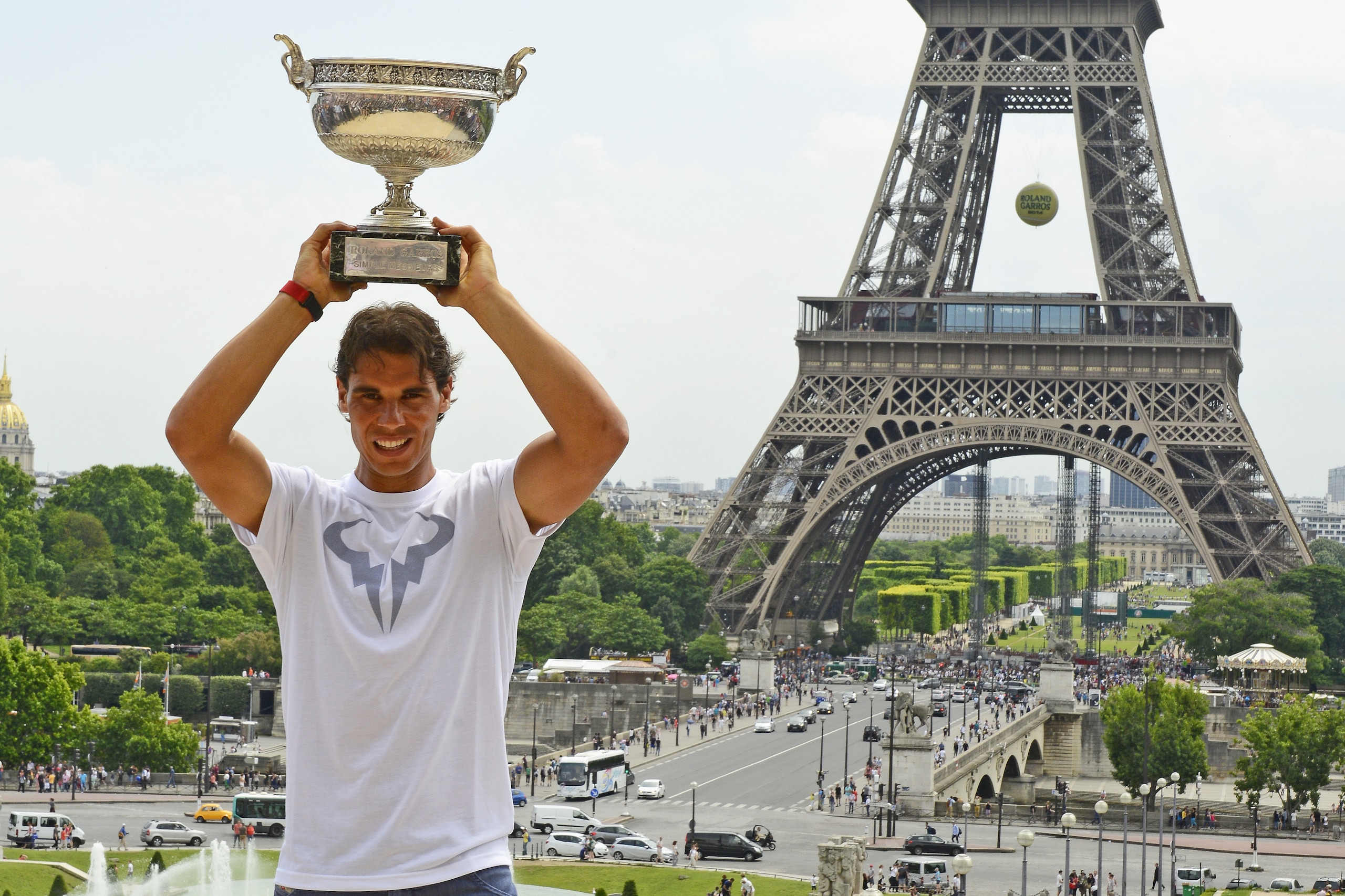 PARIS, FRANCE - JUNE 09: Rafael Nadal of Spain poses with the Coupe des Mousquetaires trophy in front of the Eiffel Tower after his victory against Novak Djokovic of Serbia during day 16 of the French Open at Roland Garros on June 9, 2014 in Paris, France.  (Photo by Frederic T Stevens/Getty Images)