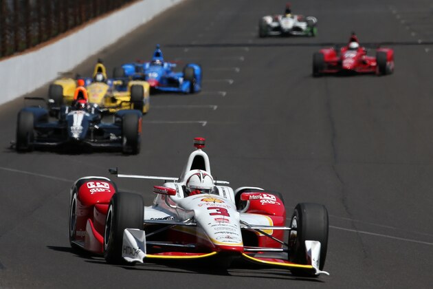INDIANAPOLIS, IN - MAY 22:  Helio Castroneves of Brazil, driver of the #3 Team Panske Chevrolet, leads a pack of cars during final practice on Carb Day for the the 99th running of the Indianapolis 500 Mile Race at Indianapolis Motorspeedway on May 22, 2015 in Indianapolis, Indiana.  (Photo by Chris Graythen/Getty Images)