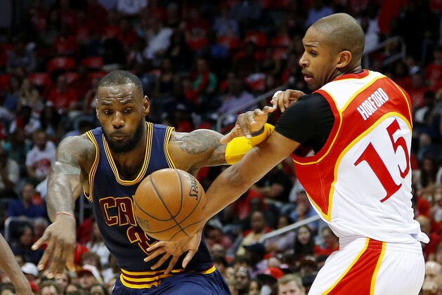 ATLANTA, GA - MAY 22:  LeBron James #23 of the Cleveland Cavaliers and Al Horford #15 of the Atlanta Hawks vie for posession during Game Two of the Eastern Conference Finals of the 2015 NBA Playoffs at Philips Arena on May 22, 2015 in Atlanta, Georgia. NOTE TO USER: User expressly acknowledges and agrees that, by downloading and or using this Photograph, user is consenting to the terms and conditions of the Getty Images License Agreement.  (Photo by Kevin C. Cox/Getty Images)