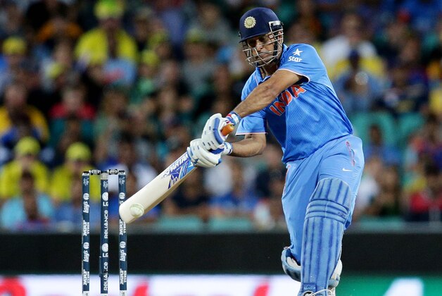India's MS Dhoni hits the ball for six runs while batting against Australia during their Cricket World Cup semifinal in Sydney, Australia, Thursday, March 26, 2015. (AP Photo/Rob Griffith)
