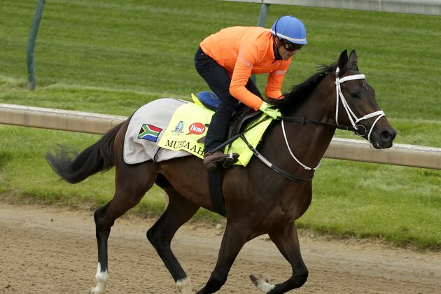 Jockey Christophe Soumillon rides Kentucky Derby hopeful Mubtaahij during a workout at Churchill Downs Thursday, April 30, 2015, in Louisville, Ky. (AP Photo/Charlie Riedel)