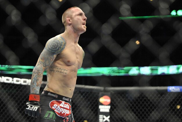 Jan 25, 2014; Chicago, IL, USA; Eddie Wineland reacts after beating Yves Jabouin (not pictured) during UFC on FOX 10 at the United Center. Mandatory Credit: David Banks-USA TODAY Sports